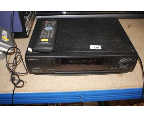 A Sharp video recorder complete with remote control 