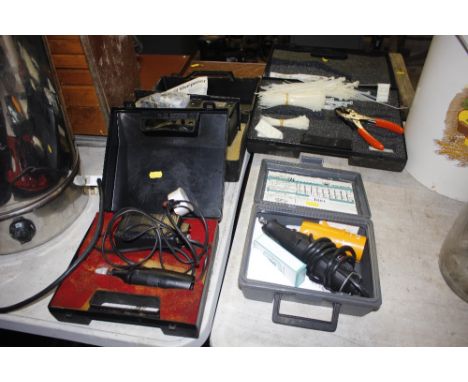 A miscellaneous collection of items including a grinder kit, a cable tie kit, drill sharpener etc.