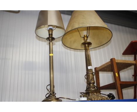 A brass corinthian column table lamp and shade and a smaller similar