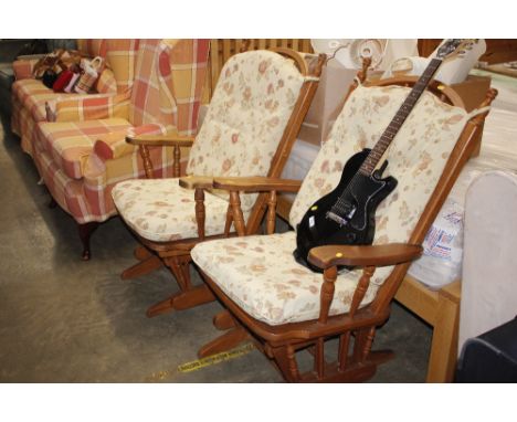 A pair of modern oak stick back rocking chairs - glide motion