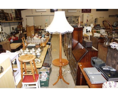 A standard lamp / occasional table, complete with shade