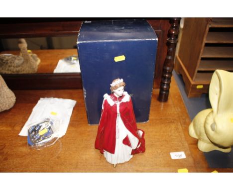 A Royal Worcester porcelain model of Queen Elizabeth II with box