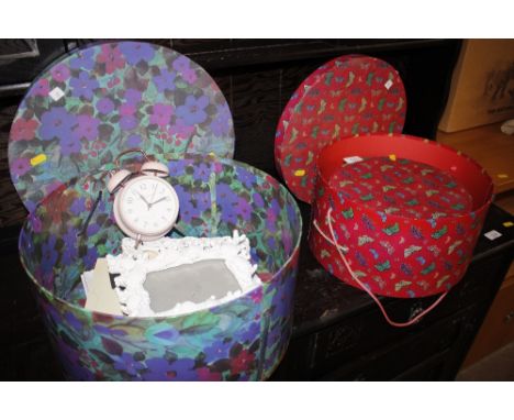 A ladies brightly coloured hat box and contents of four photograph frames; a Laura Ashley alarm clock and two butterfly decor