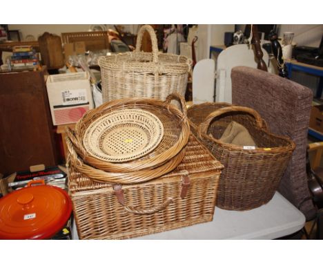 A quantity of wicker baskets including a picnic hamper; and an old hessian sack