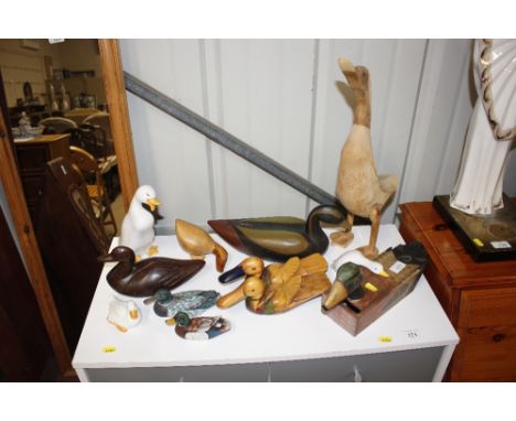 A quantity of wooden and ceramic duck ornaments 