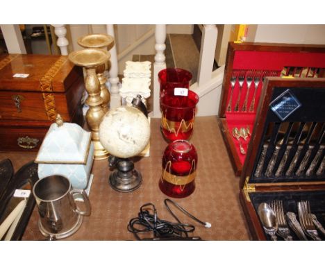 Three ruby goblets - one AF; a pair of plaster Corinthian style candlesticks; a pair of gilt candlesticks; a globe etc.