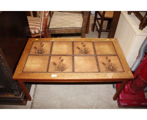 A G-plan style coffee table with tile top 