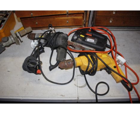 A Black &amp; Decker sander; two drills; and a soldering gun