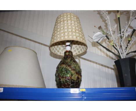 A glass bottle type table lamp