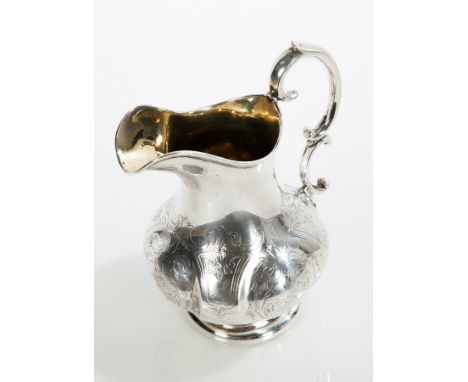 SILVER CREAM JUG
maker Henry Wilkinson & Co., Sheffield 1854, body engraved with scrolling floral design, approximately 243g,