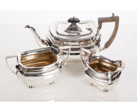 GEORGE V SILVER THREE-PIECE TEA SERVICE
maker James Deakin & Sons, Sheffield 1921, sugar 1920, of rectangular form each on fo