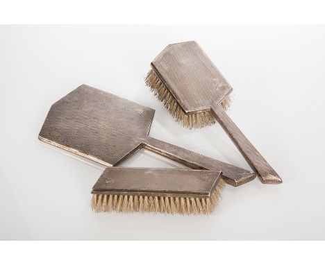SILVER ART DECO STYLE VANITY SET
maker Walker & Hall, Sheffield 1951, 1953 & 1954, comprising hand mirror, hair brush and clo