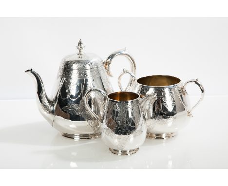 VICTORIAN MATCHED SILVER THREE-PIECE TEA SERVICE
teapot maker Martin, Hall & Co., London 1872, cream and sugar maker J Hay, E