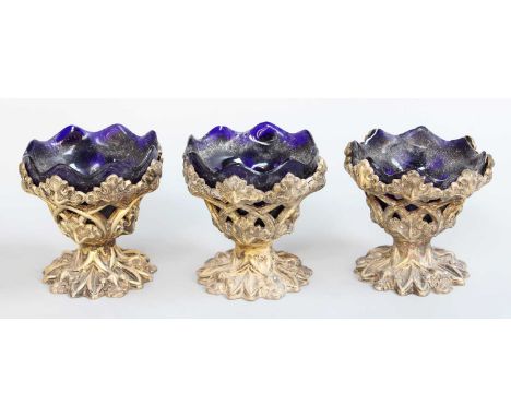 A Set of Three Victorian Silver-Gilt Salt-Cellars, by Henry Wilkinson and Co., Sheffield, 1839, 1842 and 1843, each in the Go