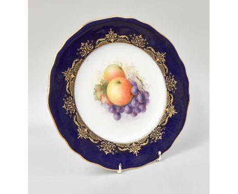 A Royal Worcester Porcelain Plate, by Richard Sebright, painted with apples and grapes under a cobalt blue and gilt border, p