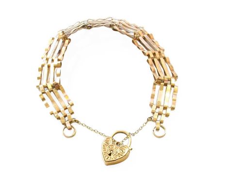 A Gate Link Bracelet, stamped '9CT', with a 9 carat gold heart shaped padlock clasp, length 18.3cmGross weight 11.4 grams.