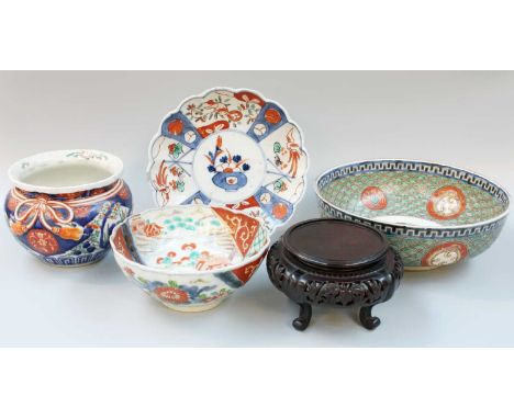 A Japanese Imari Porcelain Bowl, Meiji period; together with a similar bowl, a planter, a fluted dish, and a carved hardwood 