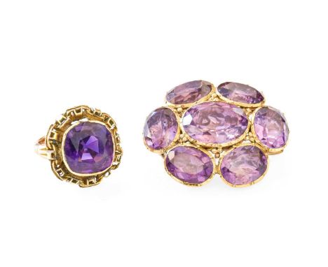 A 9 Carat Gold Amethyst Cluster Brooch, the central oval cut amethyst within a border of further oval cut amethysts, in yello