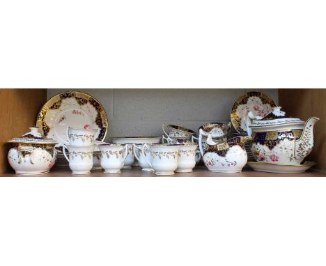 A Spode Porcelain Tea and Coffee Service, circa 1830, with wet blue and gilt borders, painted with flower sprays, including t