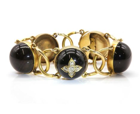 A late Victorian diamond and agate bracelet,with a series of circular agate cabochons, each one rub set in a plain collet. Al