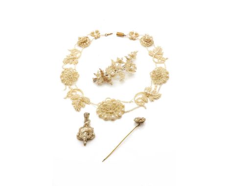 A collection of mid 19th century seed pearl jewellery,comprising a necklace with pierced chrysanthemum panels alternating wit