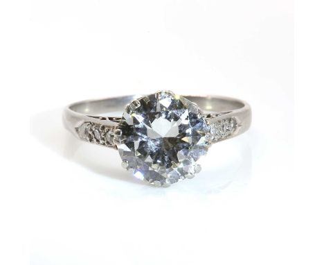 A single stone diamond ring,with diamond set shoulders, with an old brilliant cut diamond, estimated as approximately 1.85ct,