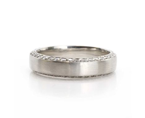 A platinum band ring with diamond edges, the 5mm wide uniform band of hallmarked platinum, London 2009, set all around both a