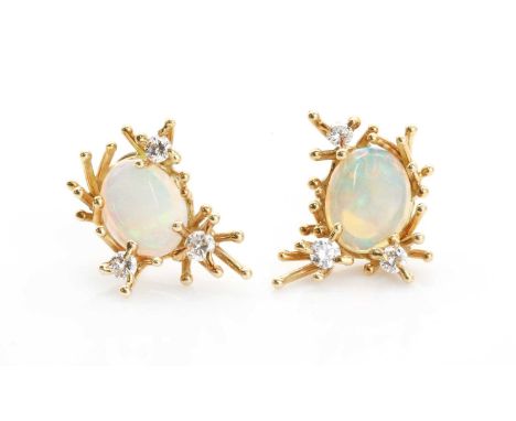 A pair of abstract opal and diamond earrings,each oval opal cabochon in an asymmetrical loose cluster of short spatulate spik