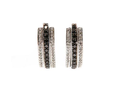 A pair of 18ct white gold three row black and colourless diamond cuff style earrings,with a central raised row of brilliant c