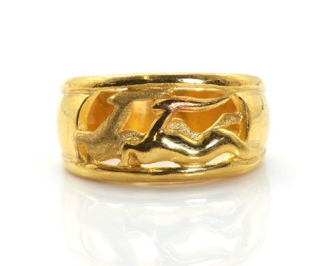 A high carat gold antelope ring,with a tapered pierced head. Two antelope, one polished, one with a sand blast finish, to an 