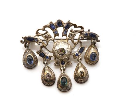 A sapphire and diamond brooch,possibly Iberian, early 18th century, with a table cut diamond set to a boss, with repoussé dec