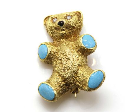 An 18ct gold diamond and enamel teddy bear brooch, by Tom O'Donahue, c.1980,with eight cut diamond set eyes, a black enamel n