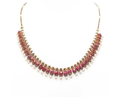 A seed pearl and ruby fringe necklace, c.1900,with a fringed centrepiece composed of milled marquise shaped open links, each 