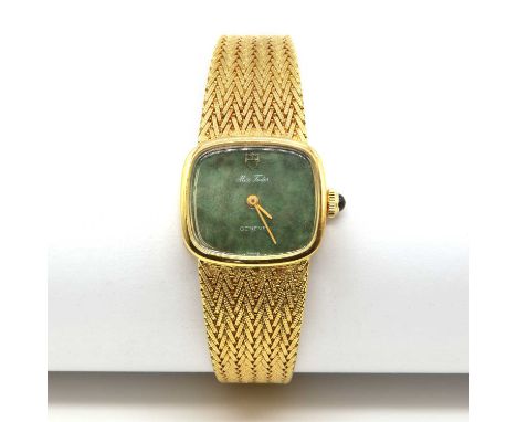 A ladies' 18ct gold Miss Tudor Geneve mechanical bracelet watch,with a cushion shaped case. A varigated green dial with a pla
