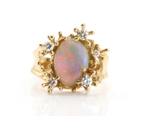 An abstract opal and diamond ring,the oval opal cabochon in closed back setting with an asymmetrical loose cluster of short s