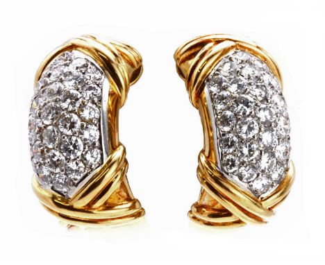 A pair of French two colour gold pavé set diamond earrings, by FRED of Paris, of rounded cuff form. A central white section, 