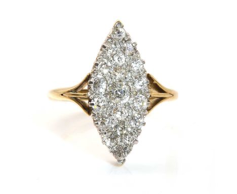 An Edwardian marquise shaped diamond cluster ring, with graduated old European and old Swiss cut diamonds, all claw set to a 