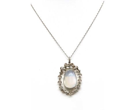 An Edwardian moonstone and diamond galleried pendant,with a pear shaped cabochon moonstone, rub set to an oval outer blade ed