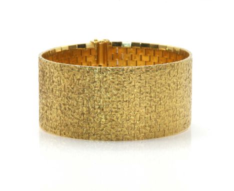 An 18ct gold eleven row brick link bracelet, by Payton Pepper Ltd., c.1966,probably retailed by Kutchinsky. Flat section bric