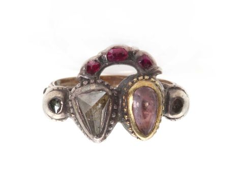 A Georgian foiled topaz, diamond and ruby twin heart ring, c.1780,with a triangular rose cut diamond and a pear cut foiled pi