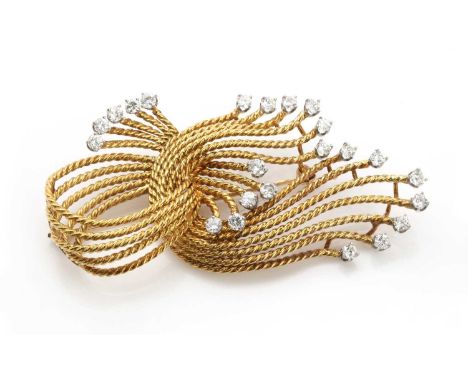 A French diamond set twisted wire knot brooch, c.1950, with strands of twisted wire gathered to a knot. Graduated brilliant c