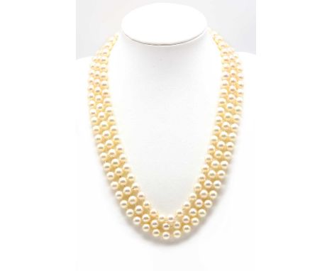 A three row uniform cultured pearl necklace,with a 9ct white gold cultured pearl and diamond cluster clasp. Three rows of uni