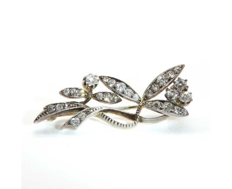 A Victorian diamond set spray brooch,with bud style clusters of old Swiss diamonds, to diamond set leaves. Pin and later roll