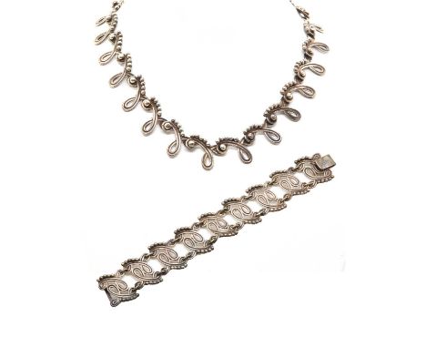 A sterling silver Mexican necklace and bracelet suite, by Antonio Reina for Taxco, c.1945,the looped swag style necklace no.9