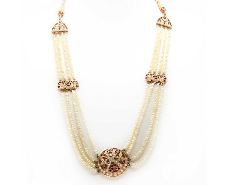 A Persian Gulf synthetic ruby and seed pearl necklace,with a roundel and swag centrepiece. A pierced disc with crossed sword 