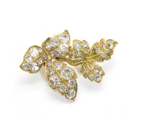 A Victorian diamond set leaf spray brooch,with two graduated leaves, grain set with graduated cushion cut, old European cut, 