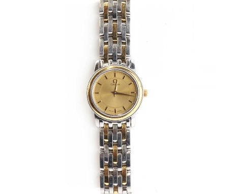 A ladies' bi-colour Omega de Ville Prestige quartz bracelet watch, c.2003,with a 22mm case. A circular champagne dial, with r