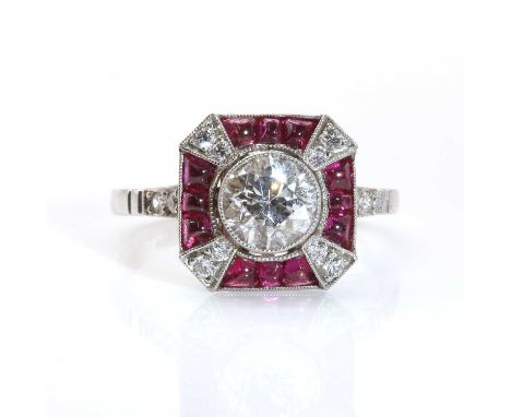 An Art Deco style diamond and ruby octagonal cluster ring,with an old European cut diamond, milligrain set to the centre. An 