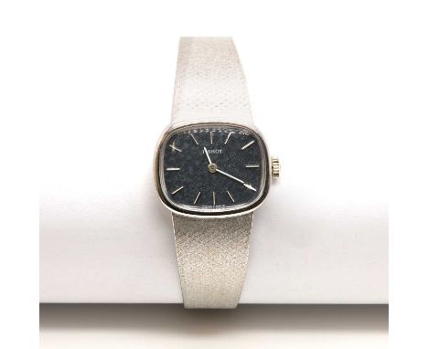 A ladies' 18ct white gold Tissot mechanical bracelet watch,with a landscape, cushion shaped case. A textured steel blue dial 