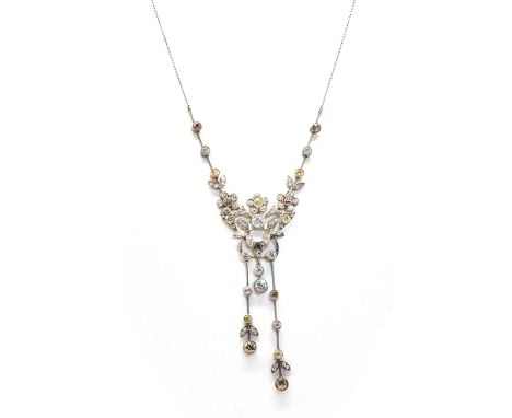 An Art Nouveau fancy diamond neglige style necklace,with a central diamond set whiplash frame with leaf sprays, all milligrai